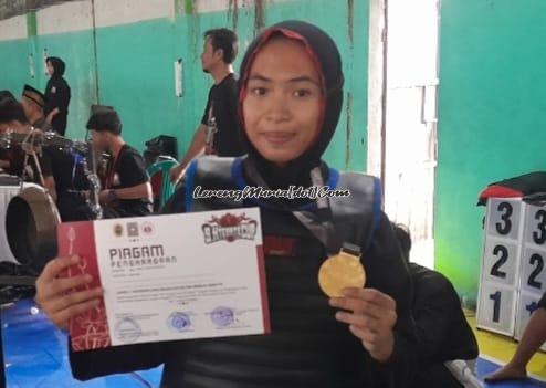 Khairaini Zalfa Nur, atlet serba bisa dari SMPN 1 Juwana meraih 2 medali emas untuk laga dan seni jurus tunggal IPSI pra remaja di SH Terate Cup VIII Cabang Pati